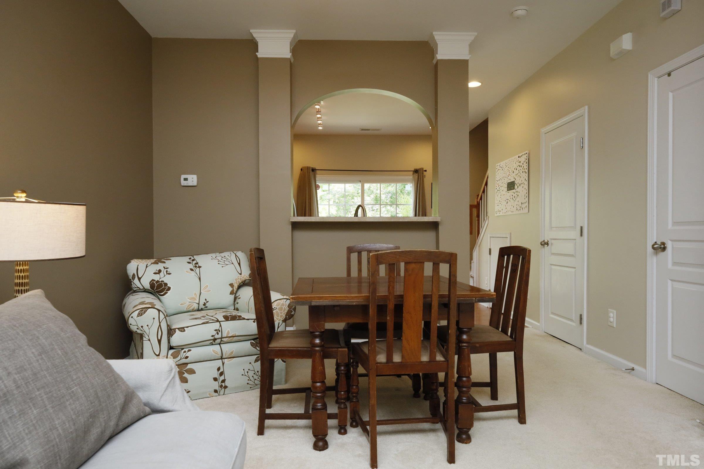 304 Red Elm Drive Durham, NC 27713 - Photo 8 of 27 a view of a dining room with furniture and window