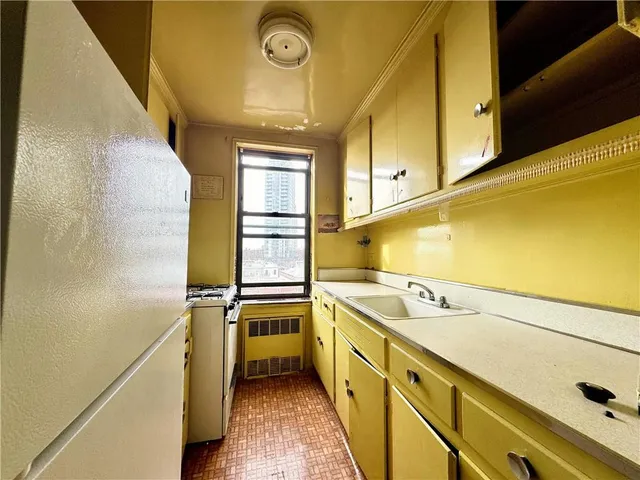 a view of a kitchen with a sink and dishwasher