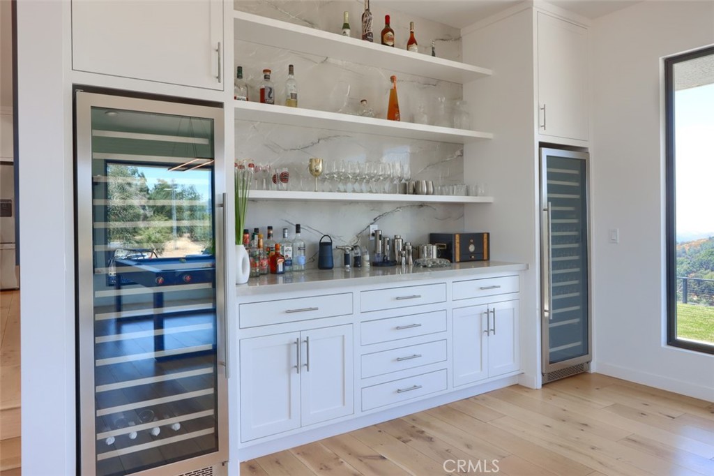 5076-5076 Allred Road Mariposa, CA 95338 - Photo 12 of 75 a kitchen with white cabinets and a window