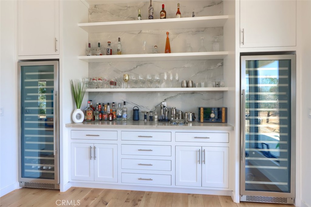 5076-5076 Allred Road Mariposa, CA 95338 - Photo 13 of 75 a kitchen with white cabinets and a potted plant