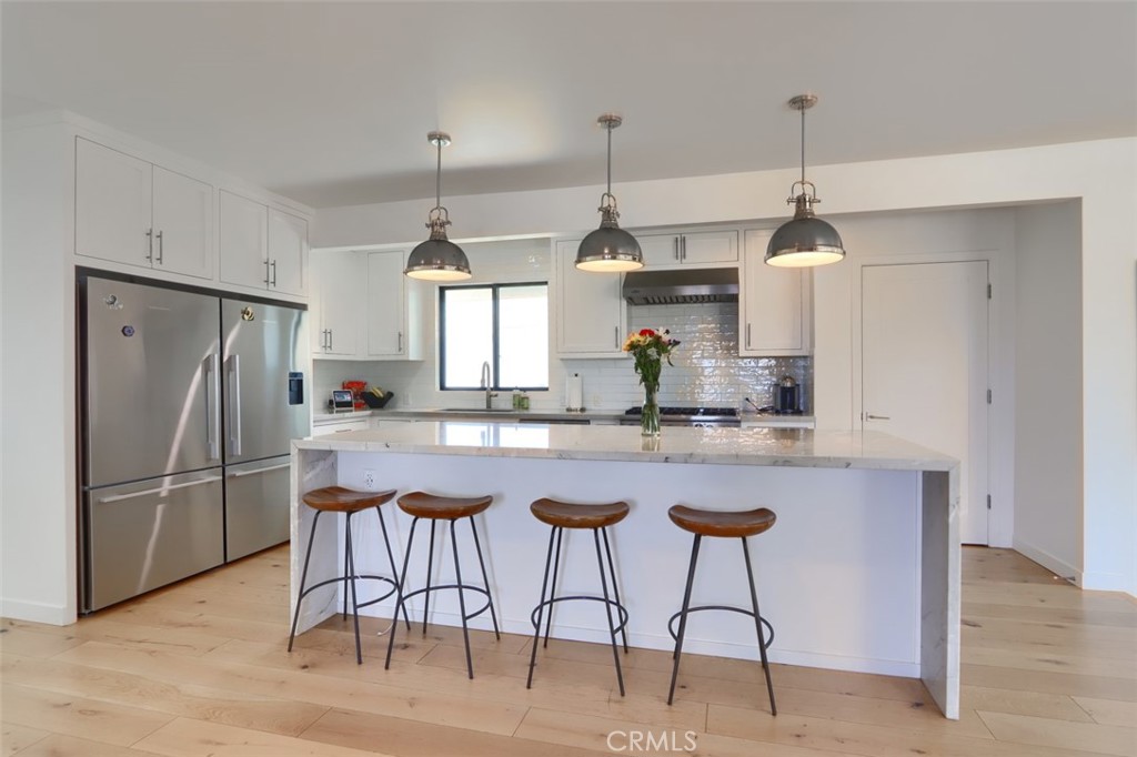 5076-5076 Allred Road Mariposa, CA 95338 - Photo 15 of 75 a kitchen with stainless steel appliances granite countertop a sink a stove a refrigerator and island