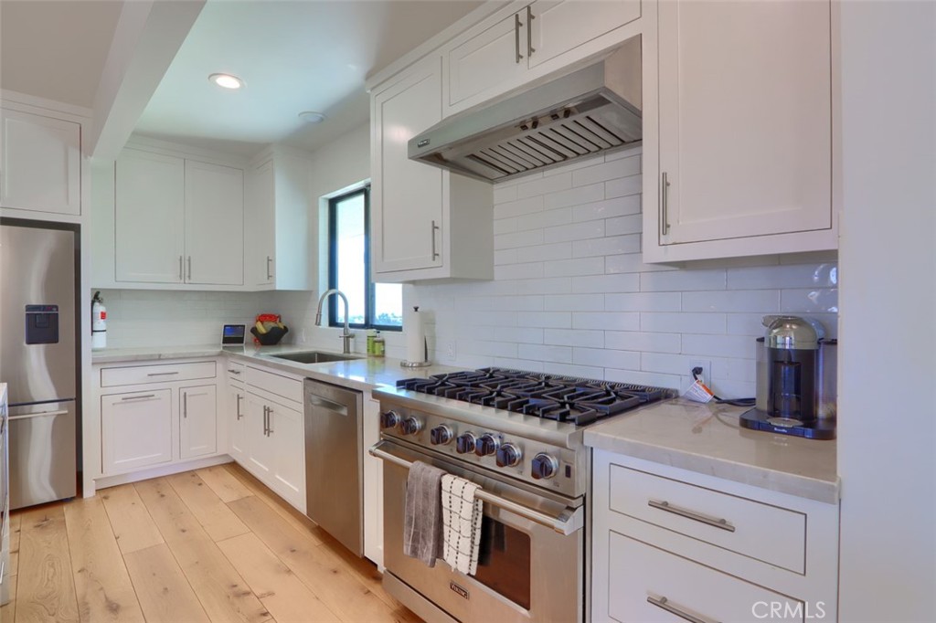 5076-5076 Allred Road Mariposa, CA 95338 - Photo 17 of 75 a kitchen with cabinets appliances a sink and a counter space