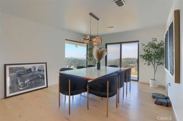 a bathroom with double sink and a mirror