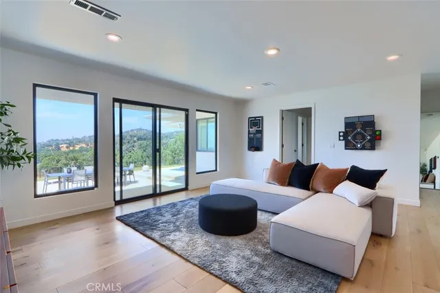 a bedroom with a bed and flat screen tv