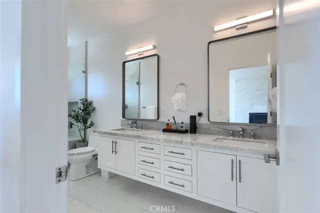 a spacious bedroom with a bed and window