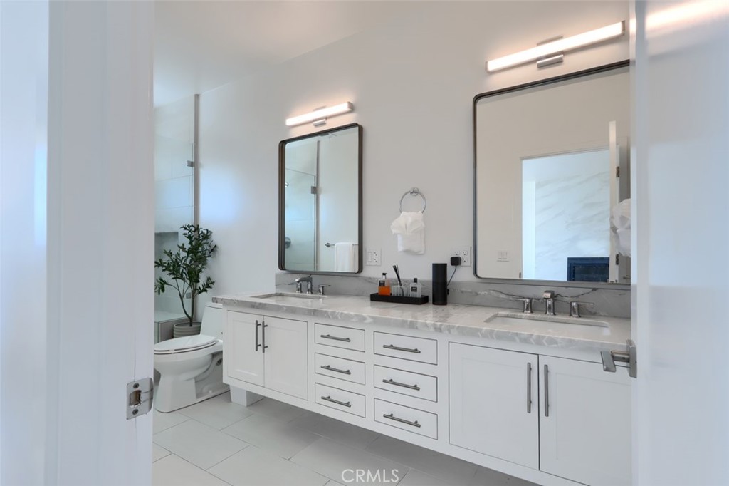 5076-5076 Allred Road Mariposa, CA 95338 - Photo 30 of 75 a bathroom with a granite countertop sink and a mirror