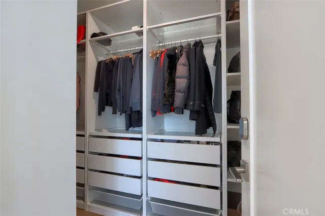 a bathroom with double vanity sinks and a mirror