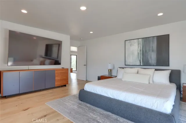 a kitchen with white cabinets and sink