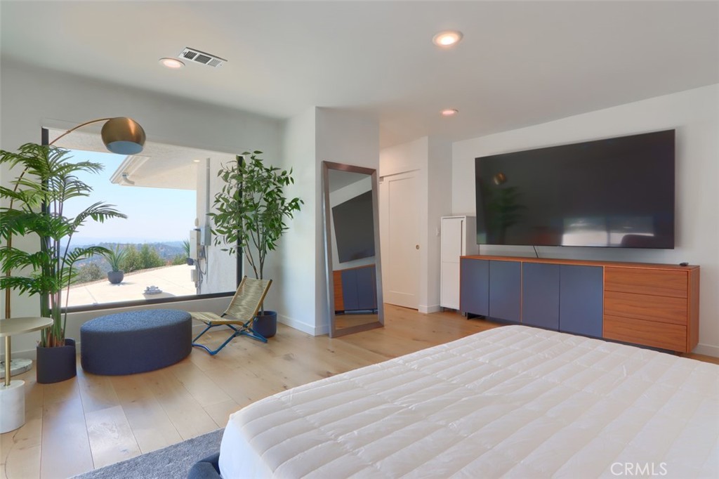 5076-5076 Allred Road Mariposa, CA 95338 - Photo 44 of 75 a bedroom with furniture and a flat screen tv