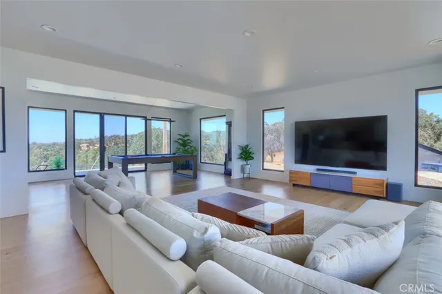 a kitchen with stainless steel appliances kitchen island a refrigerator and a stove top oven