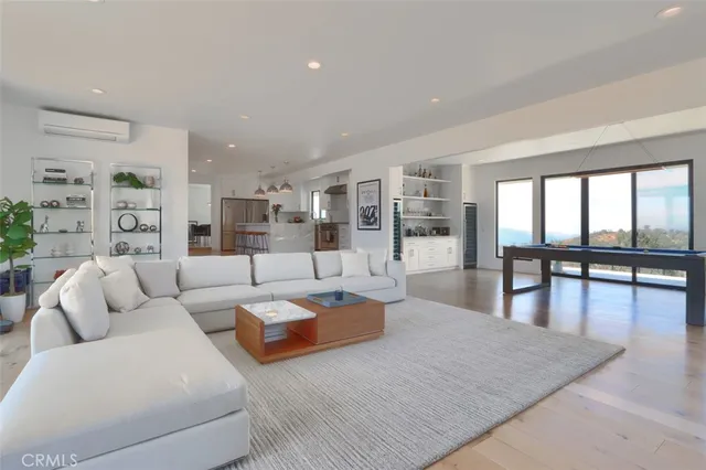 a kitchen with stainless steel appliances granite countertop a sink a stove a refrigerator and island