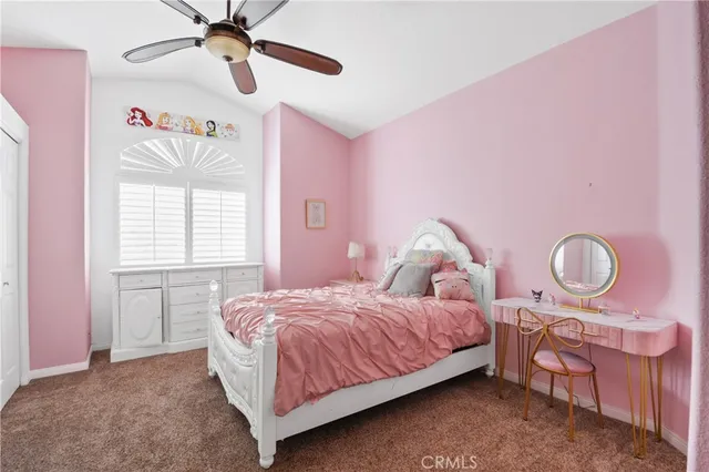 a bedroom with a bed dresser and window