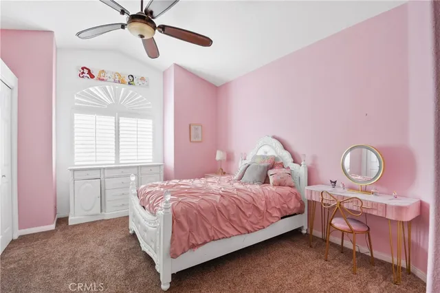 a bedroom with a bed dresser and window