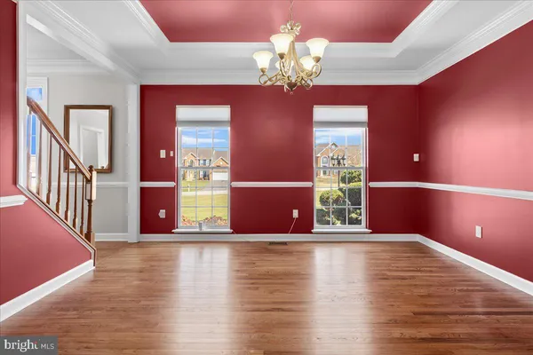 a bathroom with a toilet and a mirror