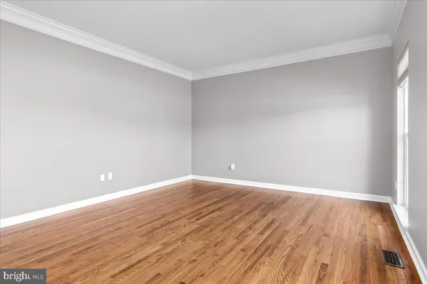 a bathroom with a granite countertop sink a toilet and a shower