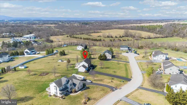 a kitchen with stainless steel appliances granite countertop wooden cabinets a stove top oven a granite counter space and stainless steel appliances