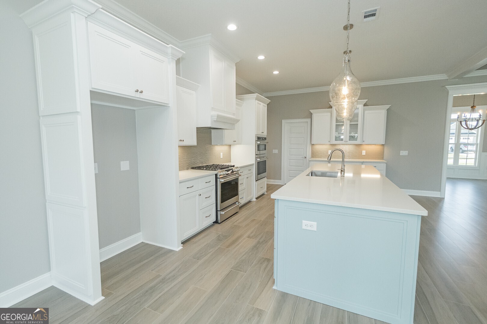 205 Riley Hunter Drive Kingsland, GA 31548 - Photo 13 of 81 a kitchen with a sink a stove a refrigerator and a window
