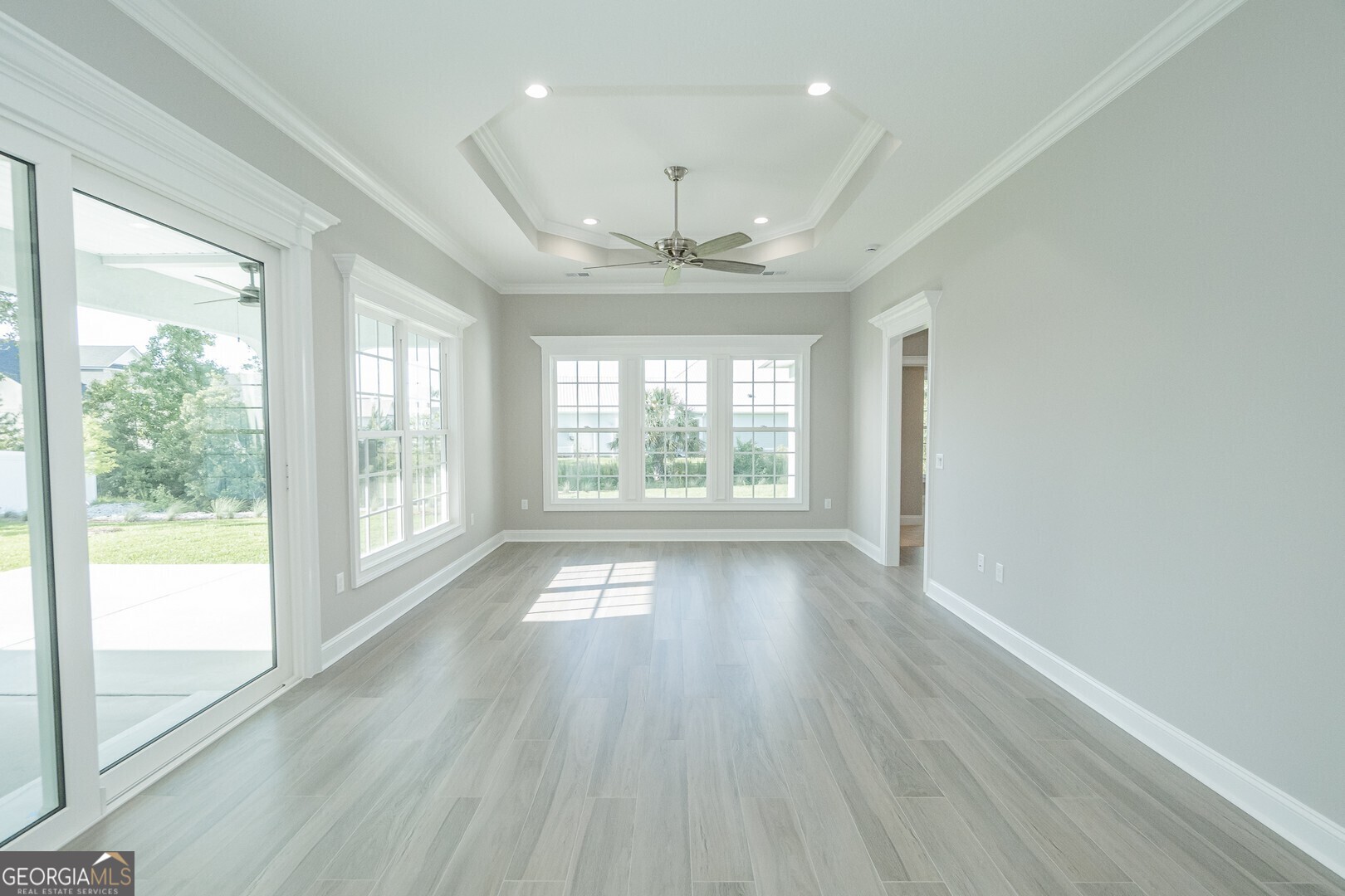 205 Riley Hunter Drive Kingsland, GA 31548 - Photo 17 of 81 a view of an empty room with wooden floor and a window