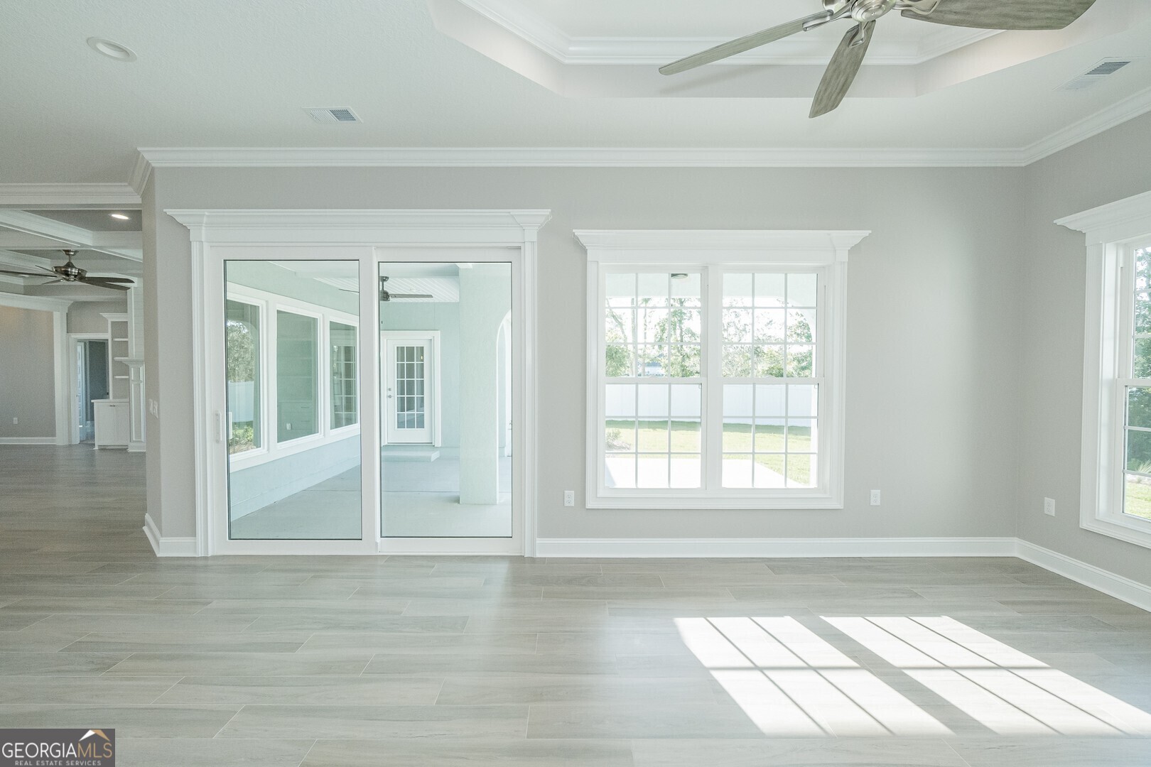 205 Riley Hunter Drive Kingsland, GA 31548 - Photo 18 of 81 an empty room with wooden floor and windows