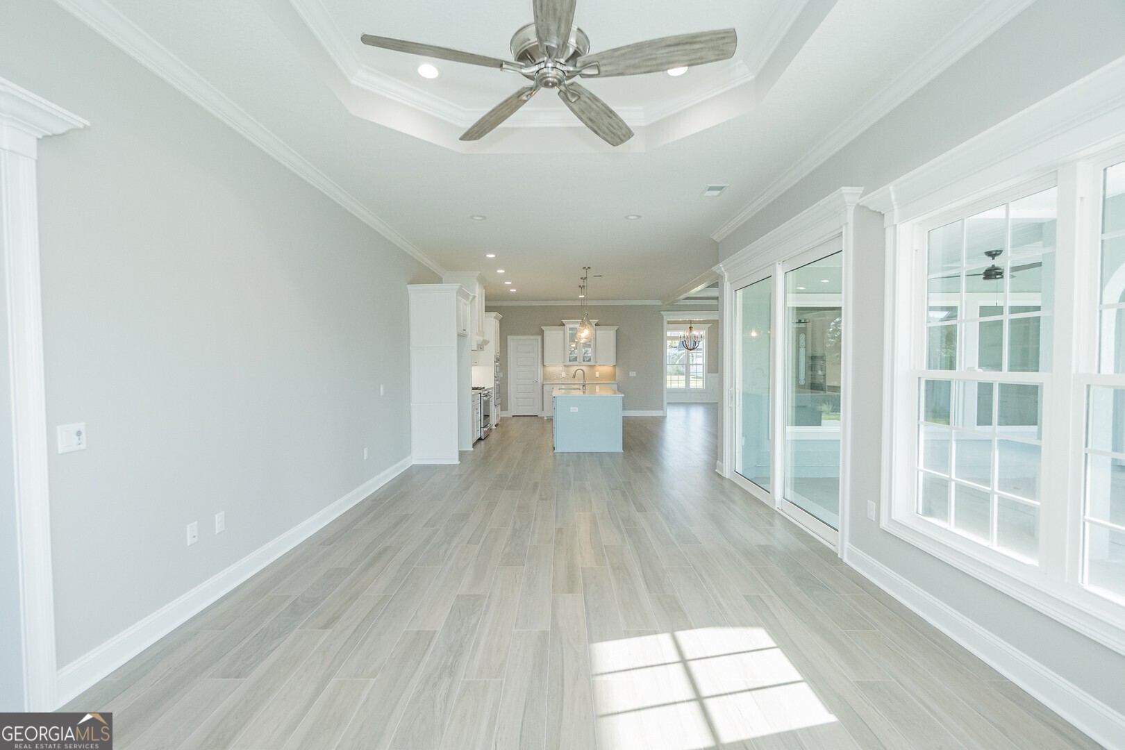 205 Riley Hunter Drive Kingsland, GA 31548 - Photo 19 of 81 a view of empty room with wooden floor and fan