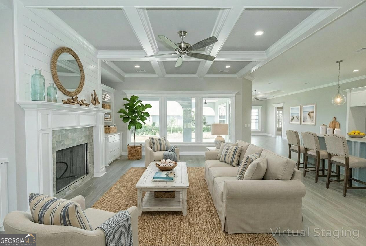 205 Riley Hunter Drive Kingsland, GA 31548 - Photo 2 of 81 a living room with furniture a fireplace and a chandelier