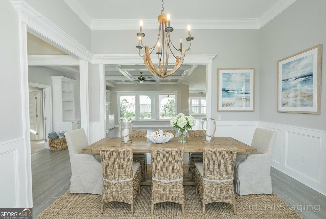 205 Riley Hunter Drive Kingsland, GA 31548 - Photo 21 of 81 a dining room with wooden floor a chandelier a wooden table and chairs