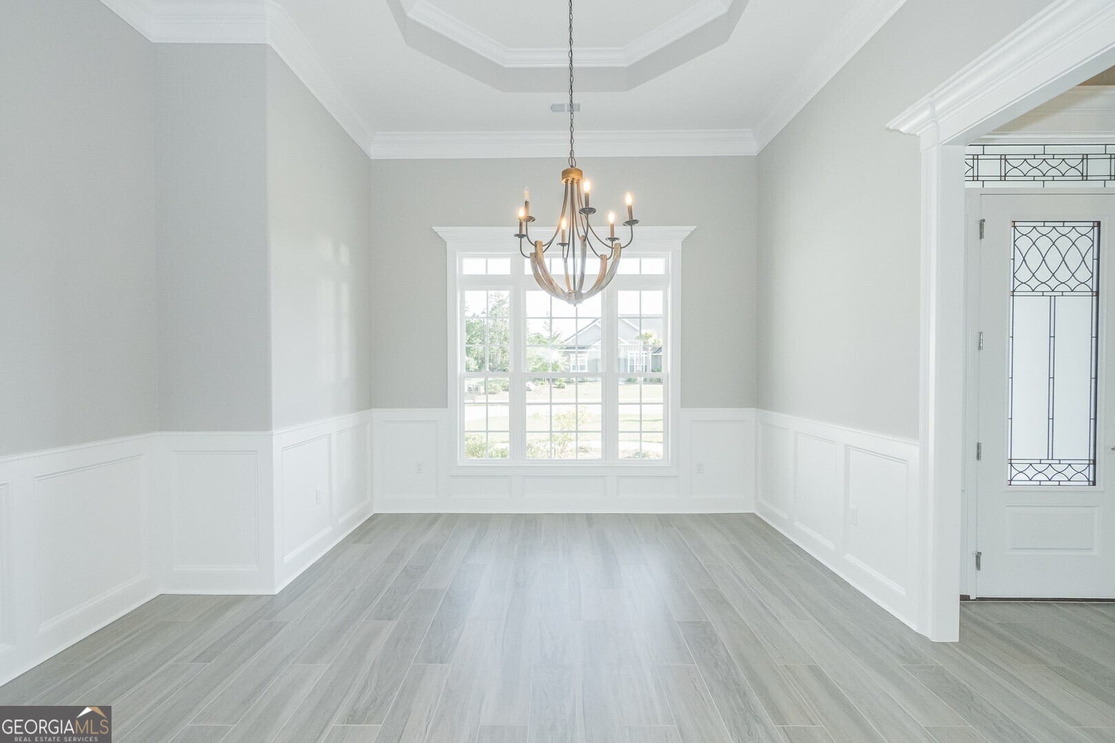 205 Riley Hunter Drive Kingsland, GA 31548 - Photo 24 of 81 a view of an empty room with wooden floor and a window