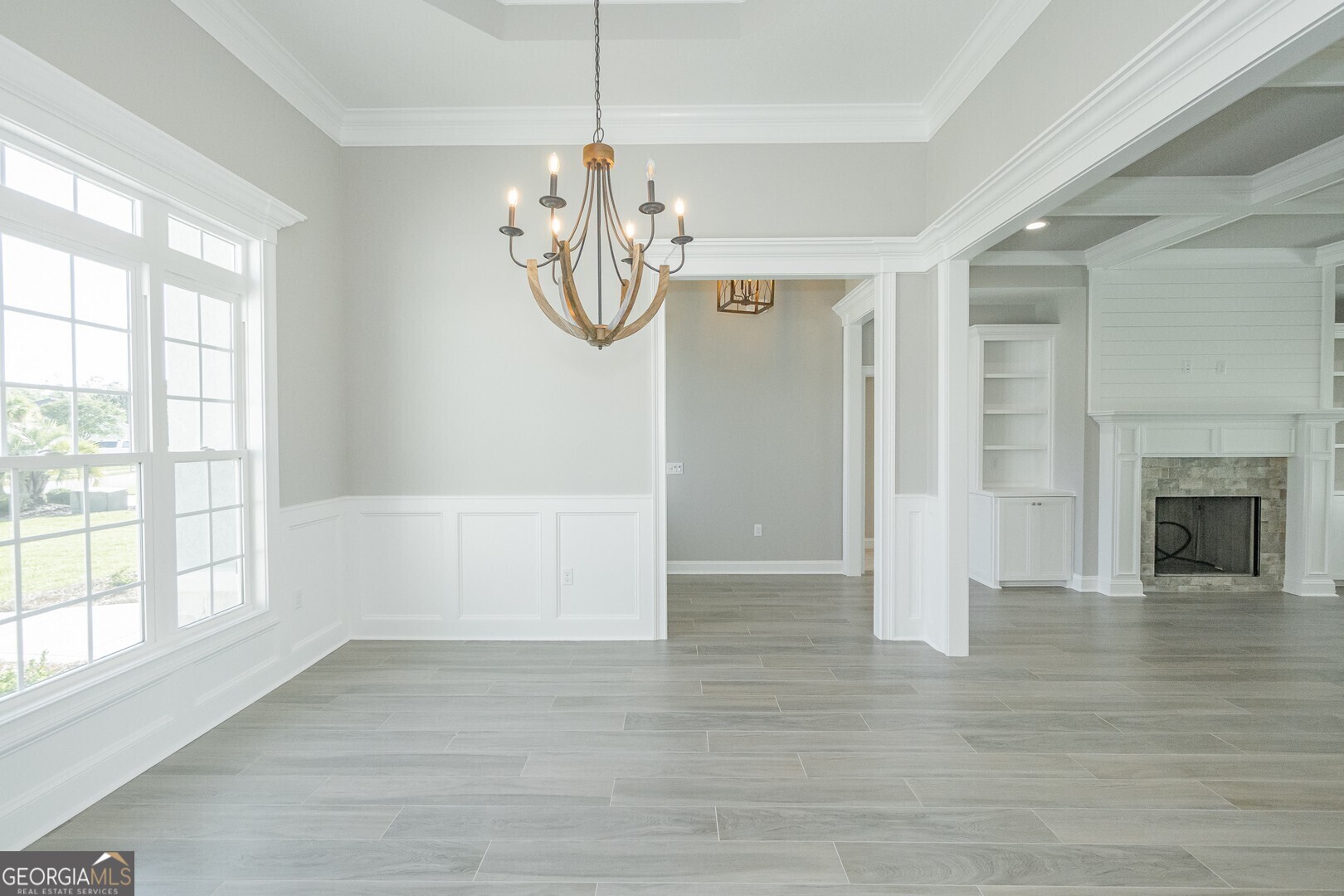 205 Riley Hunter Drive Kingsland, GA 31548 - Photo 25 of 81 a view of a livingroom with a chandelier wooden floor and a chandelier