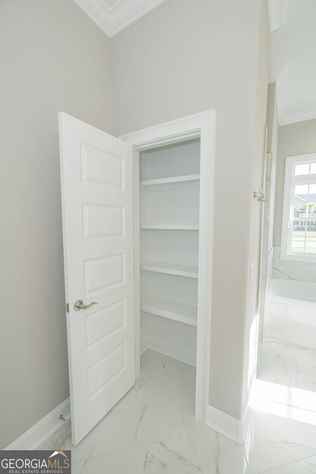 205 Riley Hunter Drive Kingsland, GA 31548 - Photo 40 of 81 a view of walk in closet with empty racks