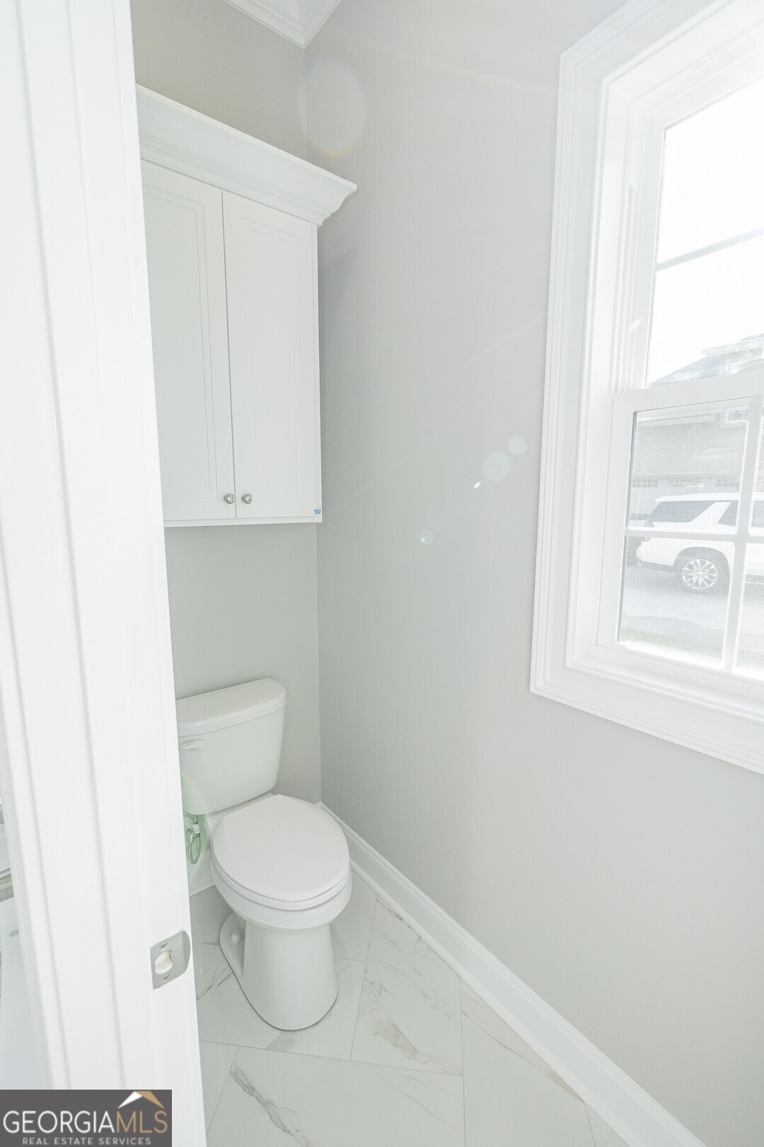 205 Riley Hunter Drive Kingsland, GA 31548 - Photo 41 of 81 a white toilet sitting next to a window