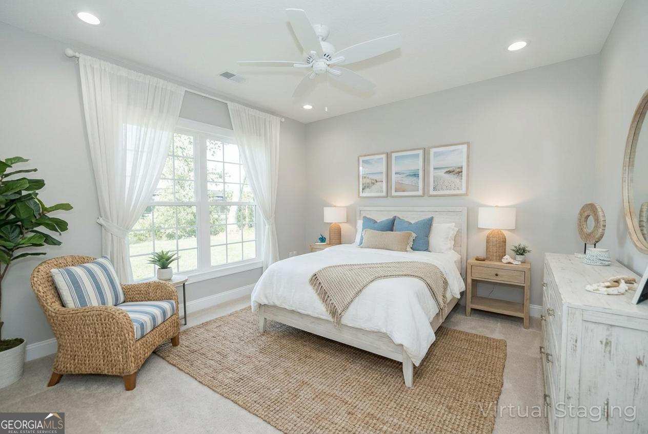 205 Riley Hunter Drive Kingsland, GA 31548 - Photo 45 of 81 a bedroom with bed couch and window