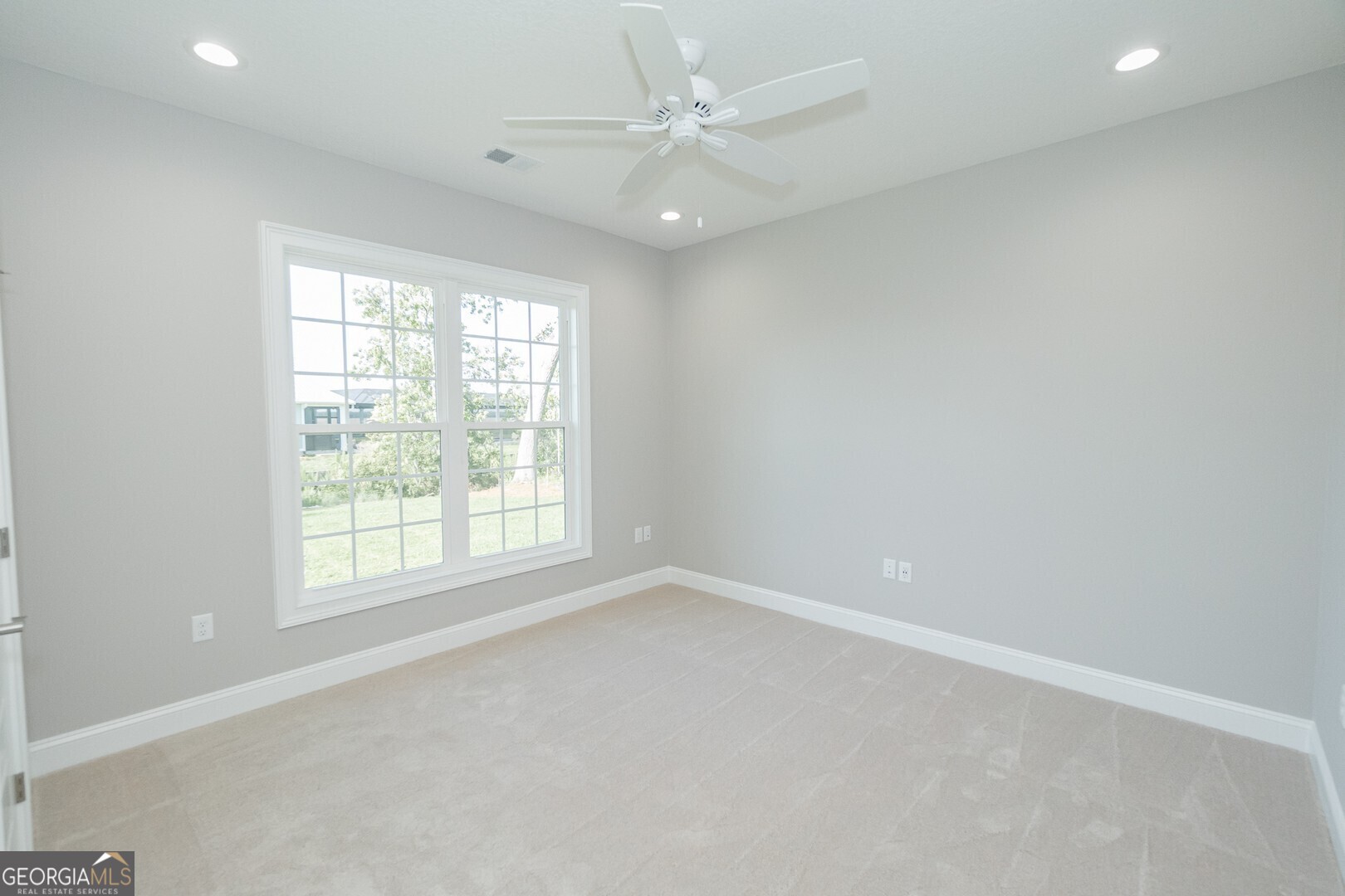 205 Riley Hunter Drive Kingsland, GA 31548 - Photo 46 of 81 an empty room with a window and a fan