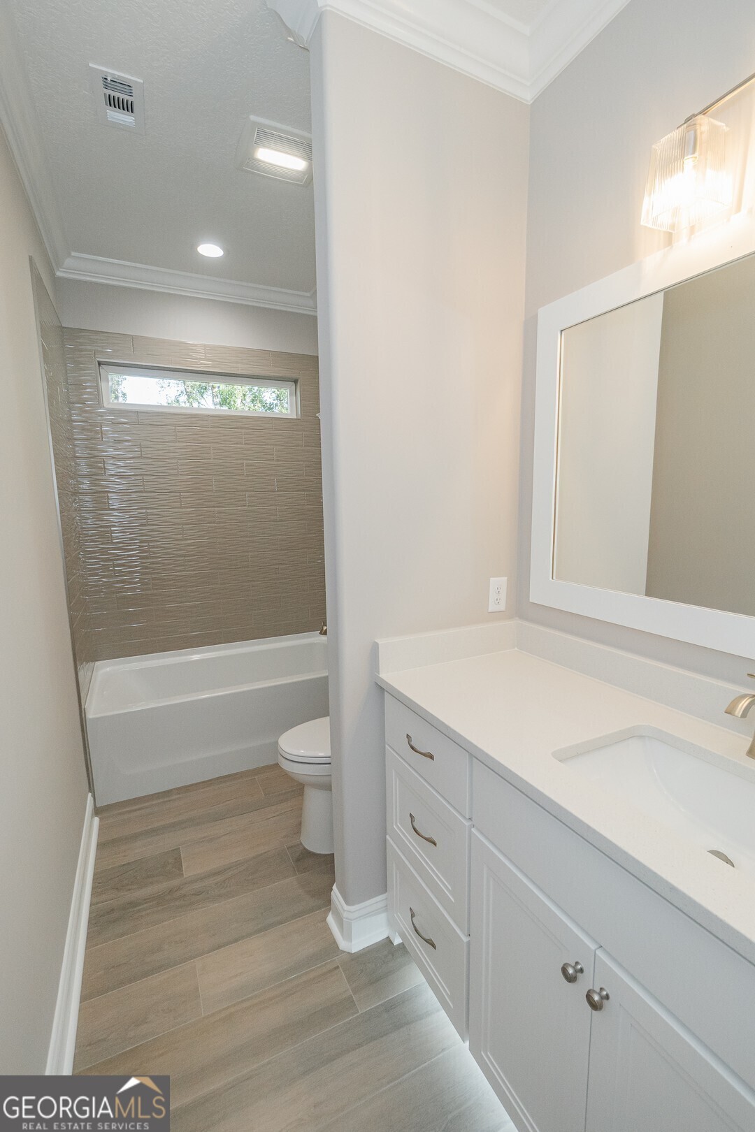 205 Riley Hunter Drive Kingsland, GA 31548 - Photo 49 of 81 a bathroom with a sink a toilet and shower