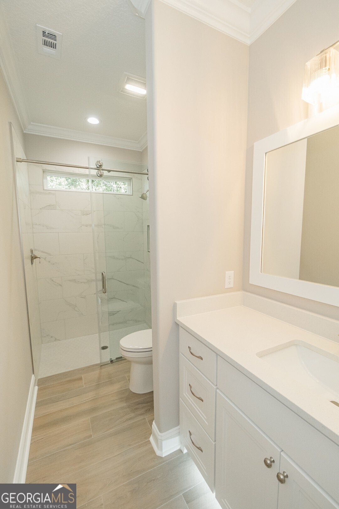 205 Riley Hunter Drive Kingsland, GA 31548 - Photo 57 of 81 a bathroom with a granite countertop sink a toilet and shower