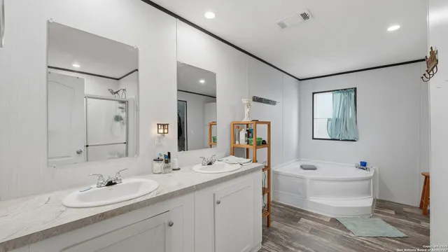 a room with furniture a chandelier and a window