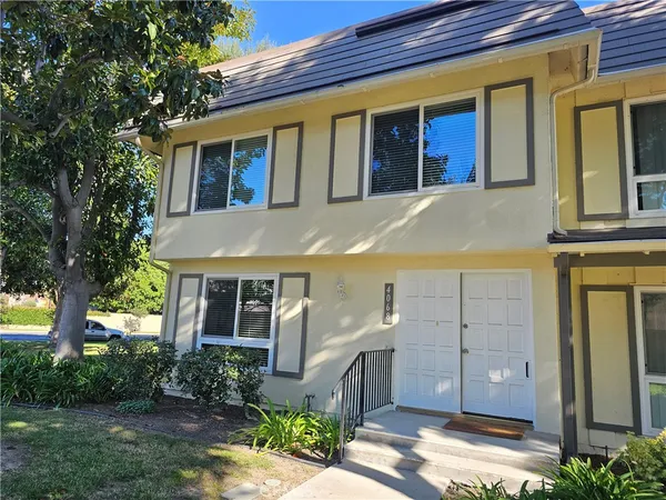 a view of a brick house with a large windows