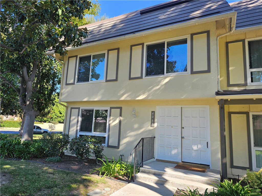 a view of a brick house with a large windows