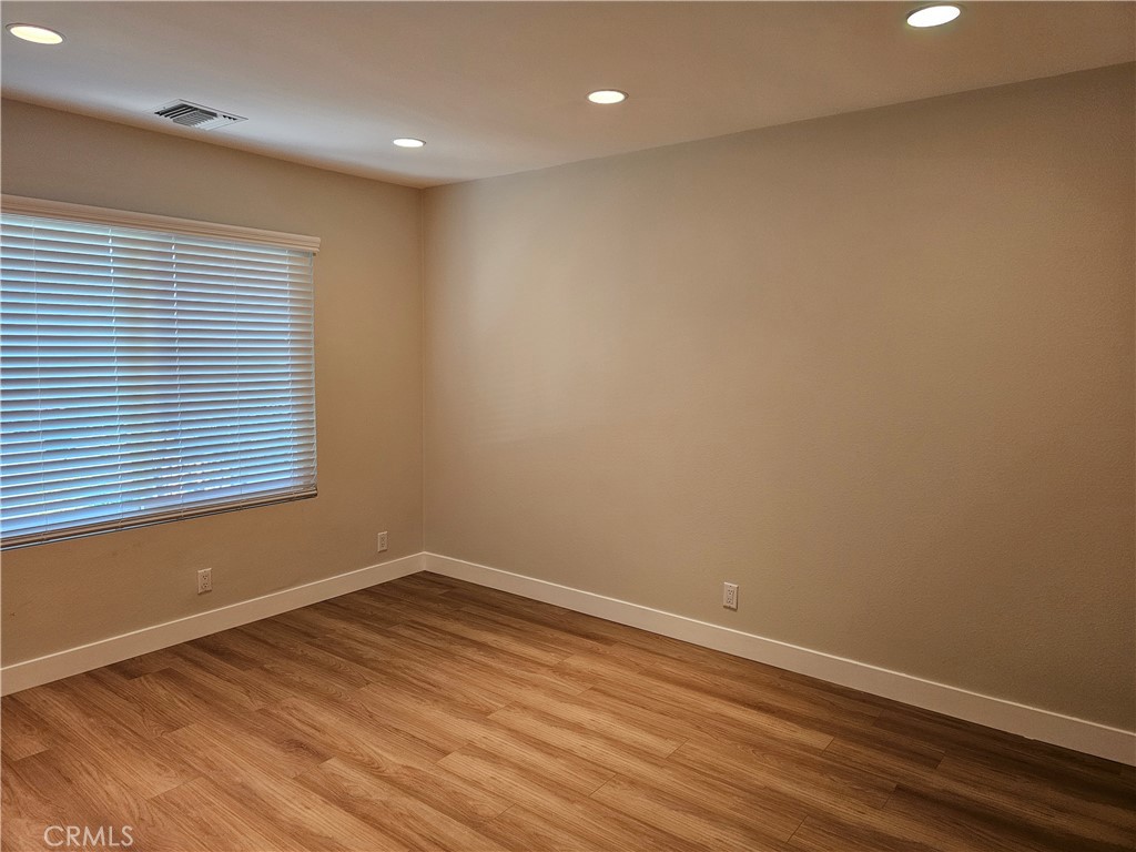 4068 Av. Sevilla Cypress, CA 90630 - Photo 14 of 17 a view of a room with wooden floor and window