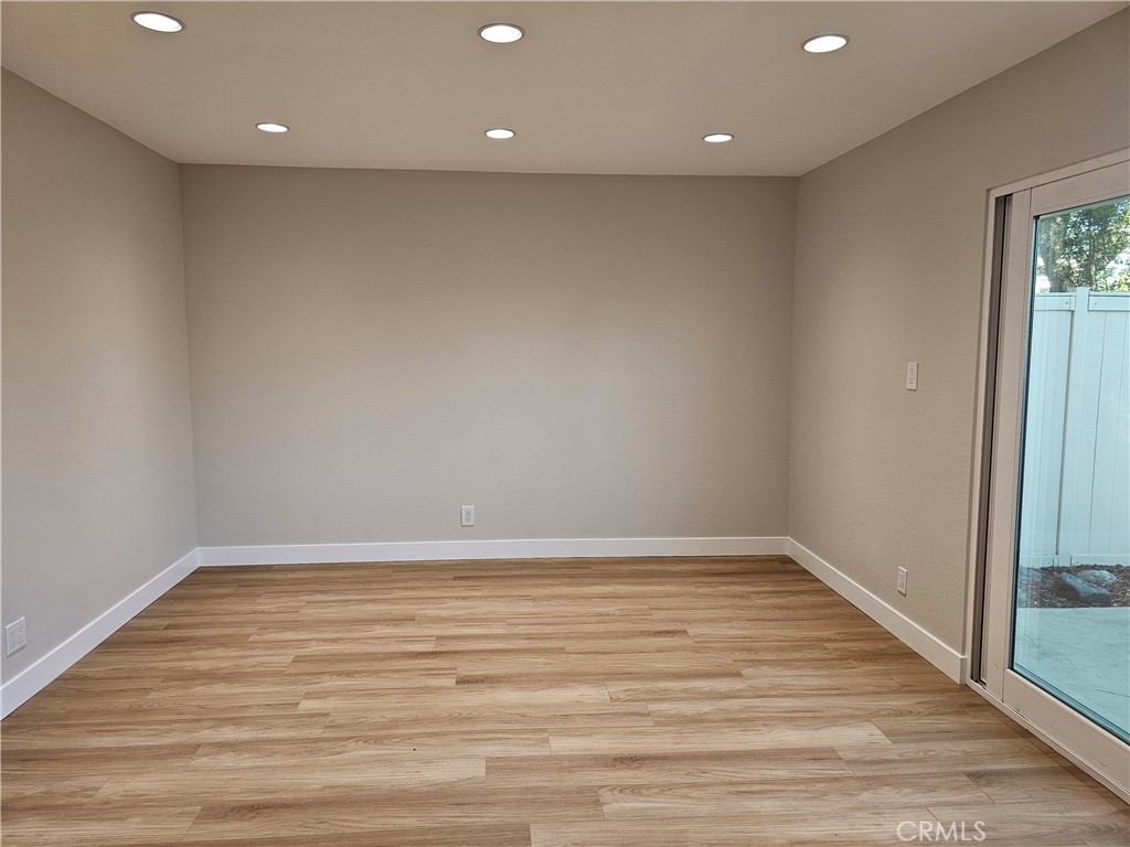 4068 Av. Sevilla Cypress, CA 90630 - Photo 6 of 17 a view of room with window and wooden floor