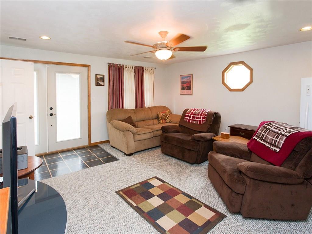 618 Cemetery Road Perryopolis, PA 15473 - Photo 5 of 25 15x15 room in addition . French doors to exterior, wall to wall carpeting and a paddle fan. A powder room is accessed from here.