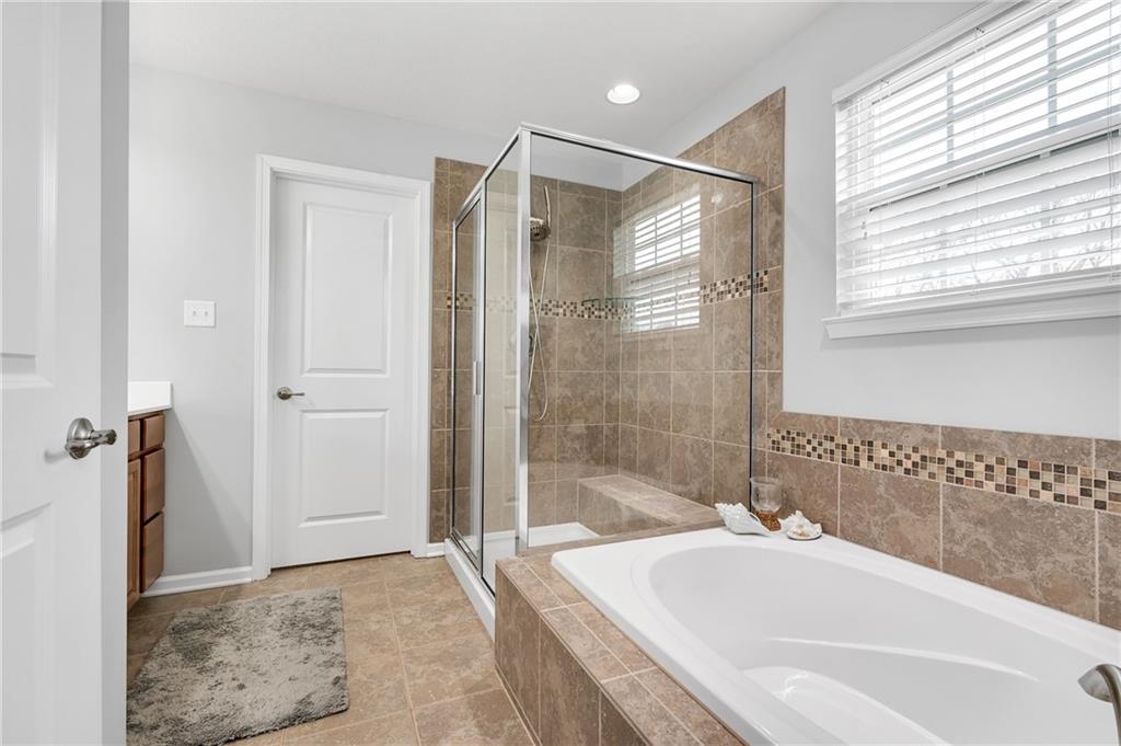 102 Pinyon Court McDonald, PA 15057 - Photo 15 of 24 a bathroom with a bathtub and a shower