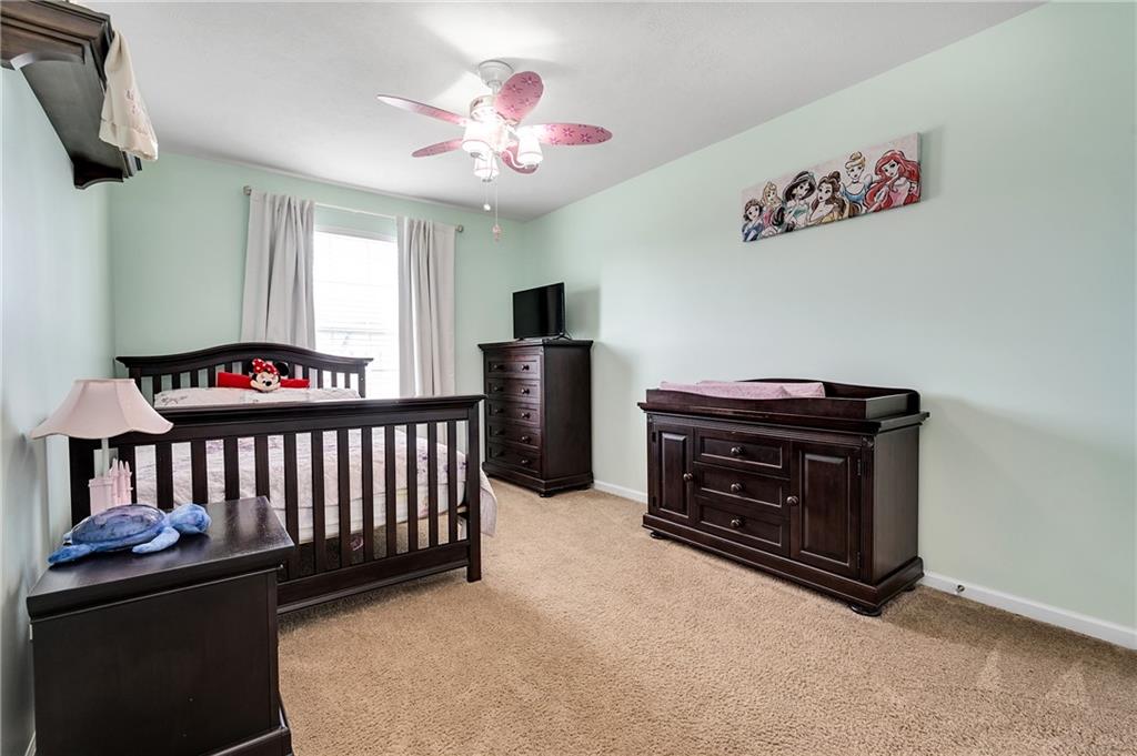 102 Pinyon Court McDonald, PA 15057 - Photo 18 of 24 a bedroom with a bed and wooden floor