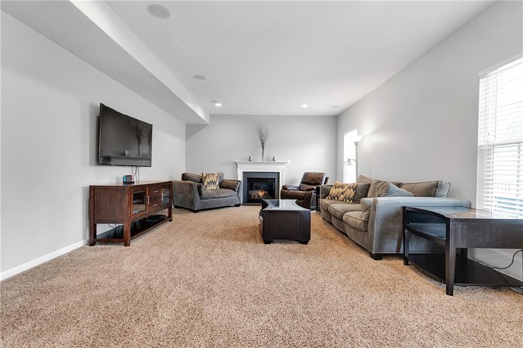 102 Pinyon Court McDonald, PA 15057 - Photo 4 of 24 a living room with furniture a flat screen tv and a window