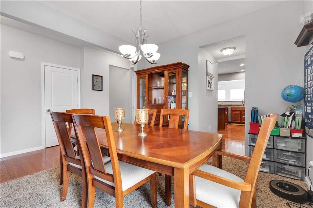 102 Pinyon Court McDonald, PA 15057 - Photo 10 of 24 a view of a dining room with furniture and wooden floor