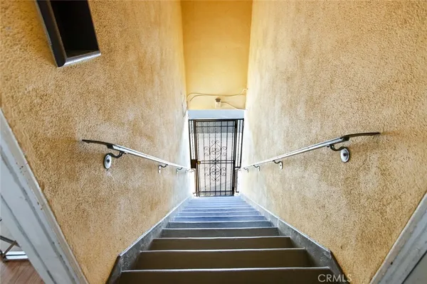 a view of a hallway with stairs