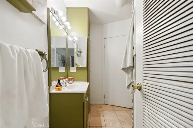 a bathroom with a sink and mirror