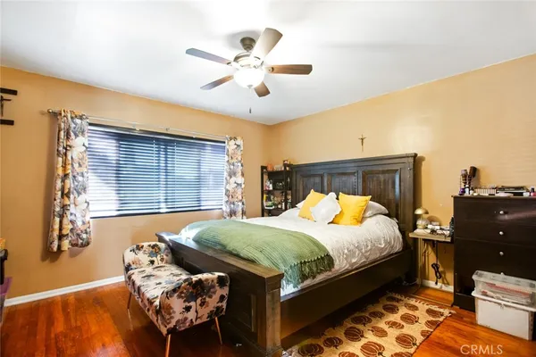 a bedroom with a bed and window