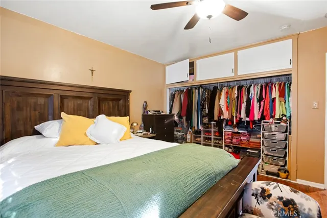 a bedroom with a bed and a walk in closet
