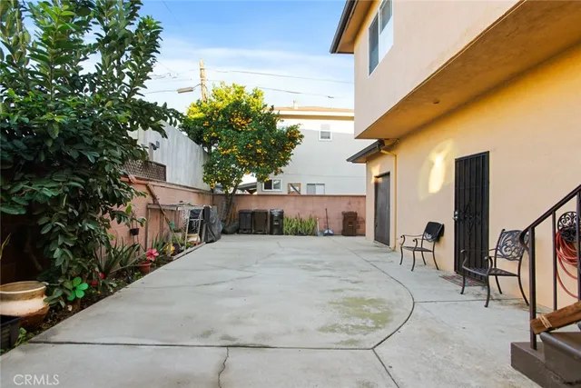a view of a building with car parked in front of house