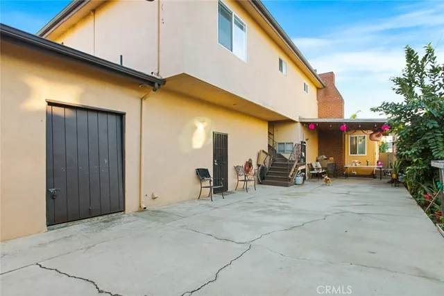 a living room with furniture a couch and dresser